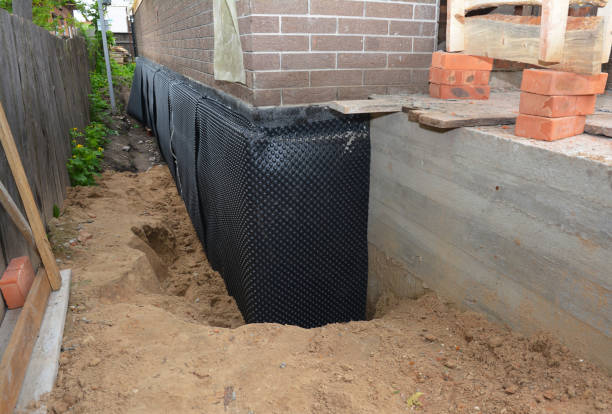 Happy homeowners after waterproofing job in Saint Bernice
